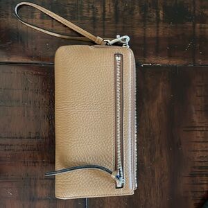 New without tags Coach tan pebbled leather wristlet with 3 inside pouches.